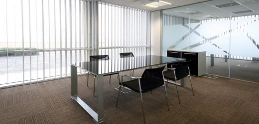 How do curtains affect the atmosphere of an office?